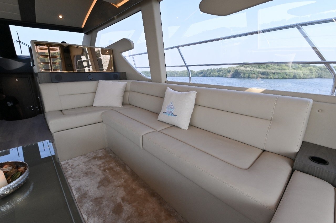 Elegant lounge and table setup inside YRD Signature 50ft yacht