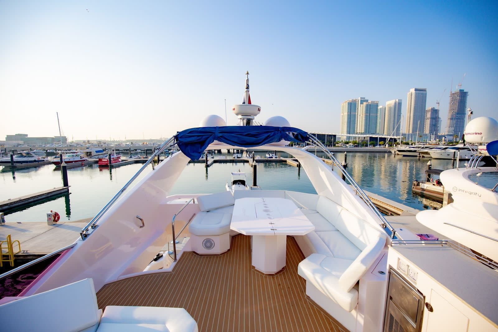 Luxury yacht cruise with skyline backdrop on YRD Prestige 70ft